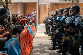 Photo of police confronting protestors